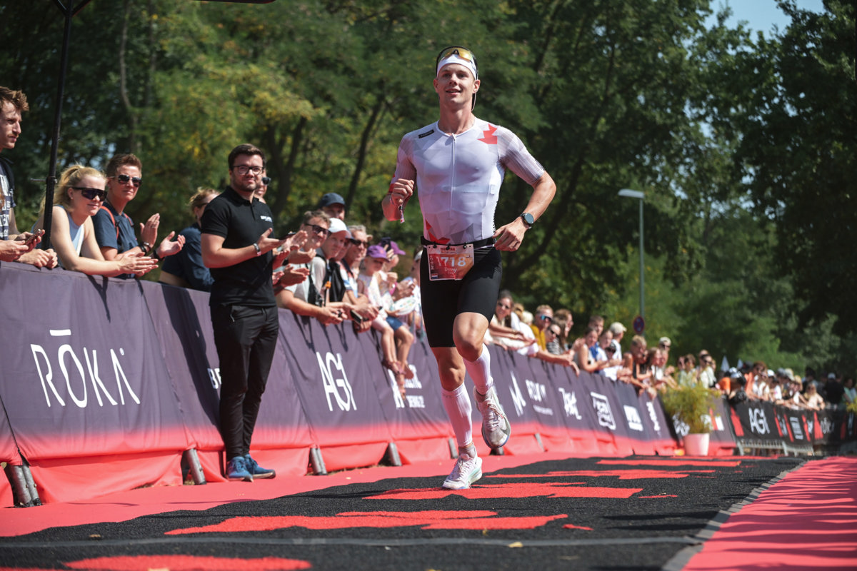 Hero image of website seeing Danny run down the finish line at Ironman 70.3 Duisburg